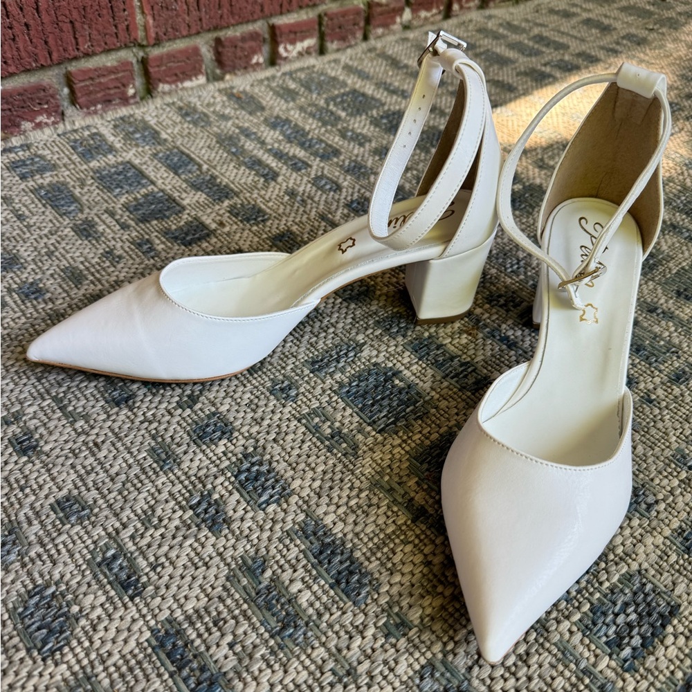 Size 7 true white block heel. Heel height = 2 1/4 in. Never worn, made in Europe